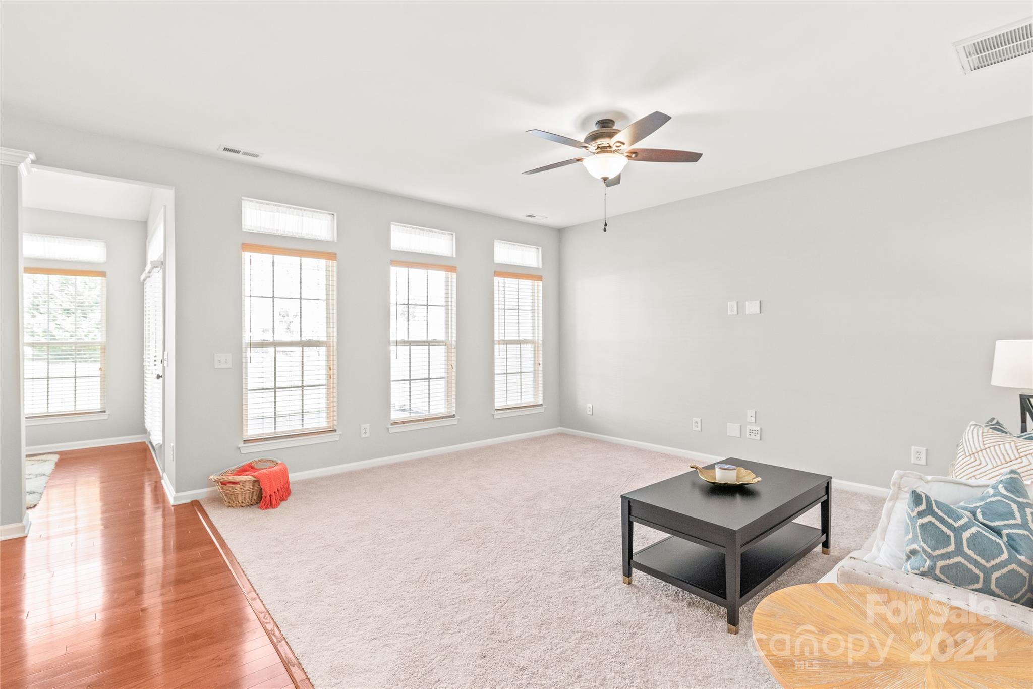 205 Snead Road Fort Mill, SC 29715 - Photo 11 of 33 an empty room with windows and ceiling fan