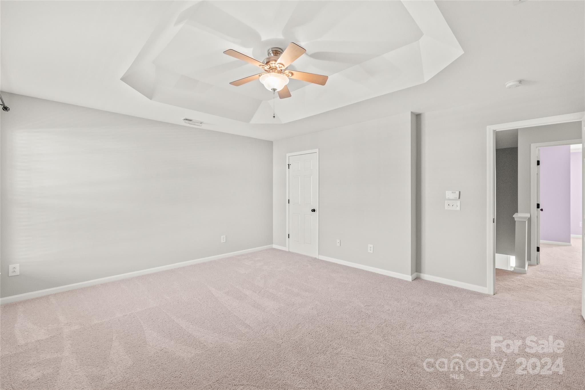 205 Snead Road Fort Mill, SC 29715 - Photo 16 of 33 wooden floor in an empty room with a chandelier fan