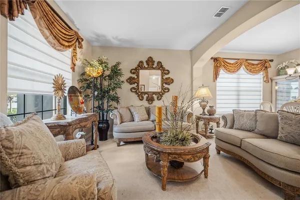 a dining room with furniture and window
