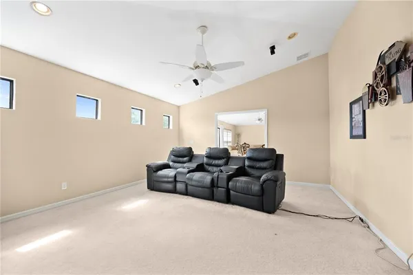 a spacious bathroom with a double vanity sink toilet mirror and bathtub