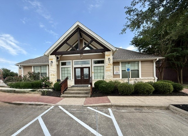 1000 Spring Loop, Unit 1806 College Station, TX 77840 - Photo 24 of 33 a front view of a house with a yard