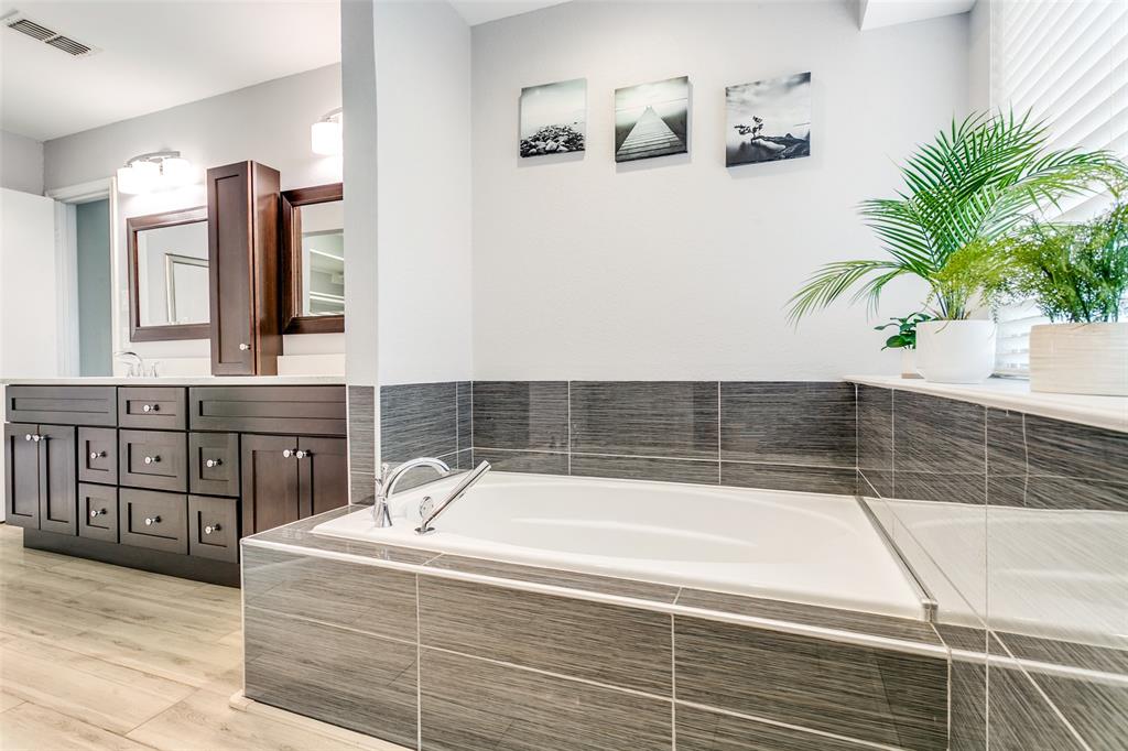 200 Lark Lane Euless, TX 76039 - Photo 16 of 25 a bathroom with a bathtub and a sink
