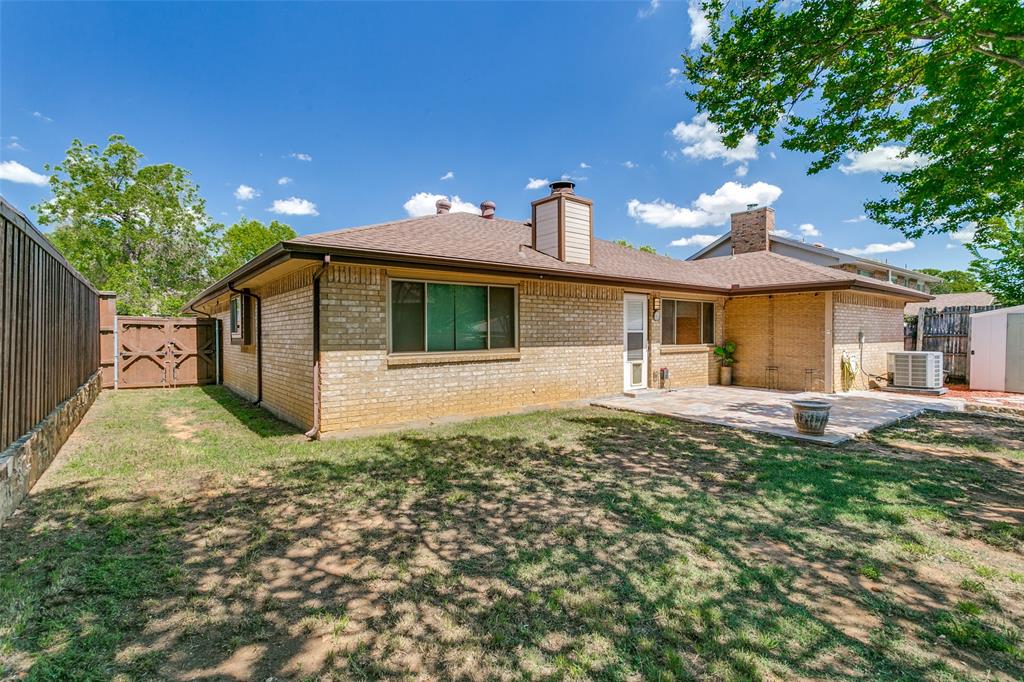 200 Lark Lane Euless, TX 76039 - Photo 23 of 25 a front view of a house with garden