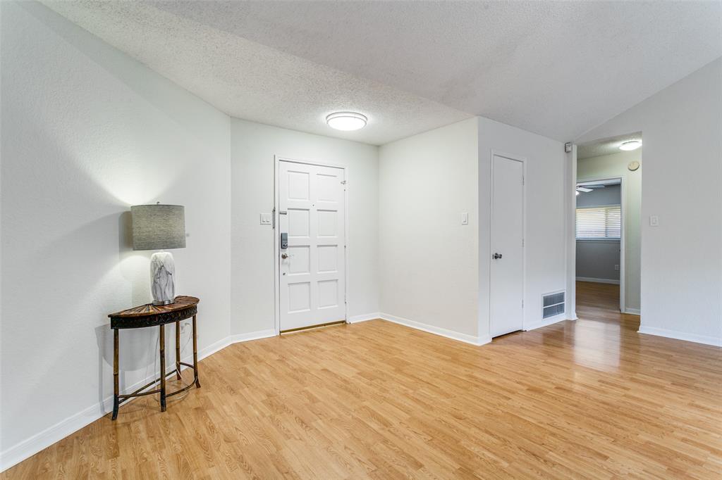 200 Lark Lane Euless, TX 76039 - Photo 4 of 25 a bedroom with a bed and a table
