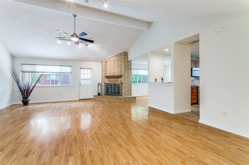 200 Lark Lane Euless, TX 76039 - Photo 5 of 25 a view of empty room with wooden floor and fan