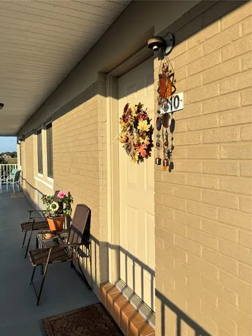 a living room with furniture and flowers