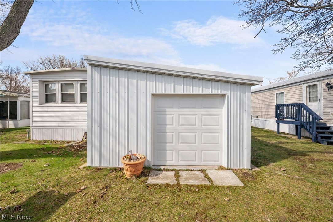 1623 Northeast Catawba Road, Unit 160 Port Clinton, OH 43452 - Photo 26 of 28 Storage shed with overhead door