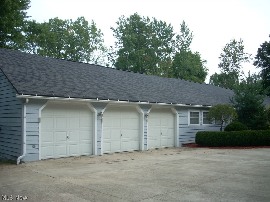 6931 North Ridge Road East Geneva, OH 44041 - Photo 23 of 25 Oversized 3 car garage with 3 door openers and lots of storage space.