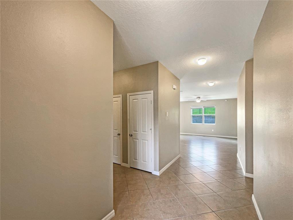 10017 Weathers Loop Clermont, FL 34711 - Photo 18 of 23 a view of livingroom with hallway