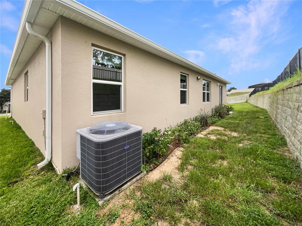 10017 Weathers Loop Clermont, FL 34711 - Photo 21 of 23 a front view of a house with garden
