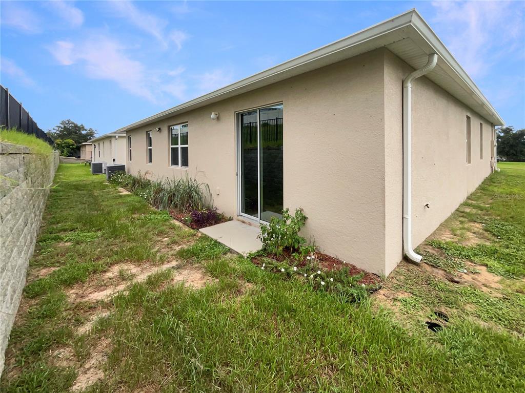 10017 Weathers Loop Clermont, FL 34711 - Photo 22 of 23 a view of a house with a yard