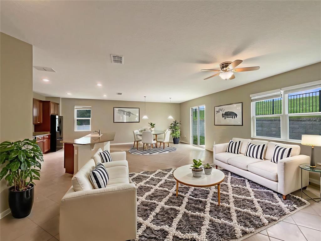10017 Weathers Loop Clermont, FL 34711 - Photo 3 of 23 a living room with furniture and a large window