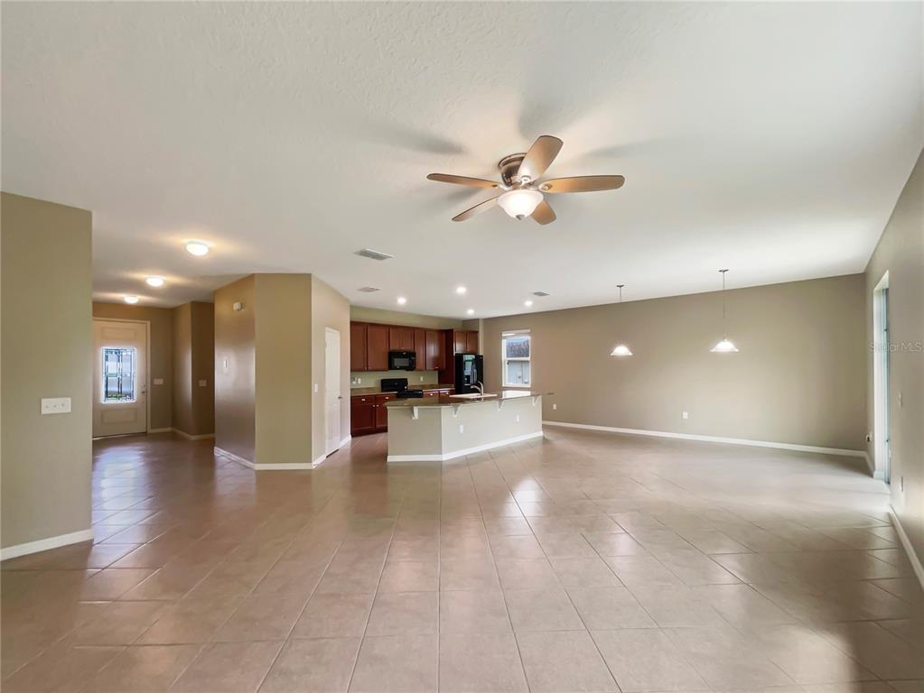 10017 Weathers Loop Clermont, FL 34711 - Photo 8 of 23 a view of a kitchen with a sink and a stove top oven