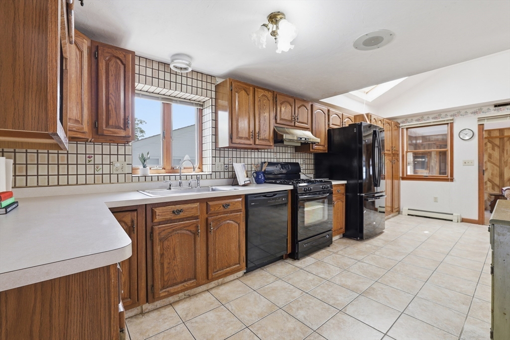 7 Swift Avenue Wareham, MA 02571 - Photo 7 of 42 a kitchen with stainless steel appliances granite countertop a sink stove and refrigerator
