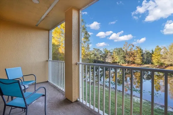 a view of a balcony with furniture