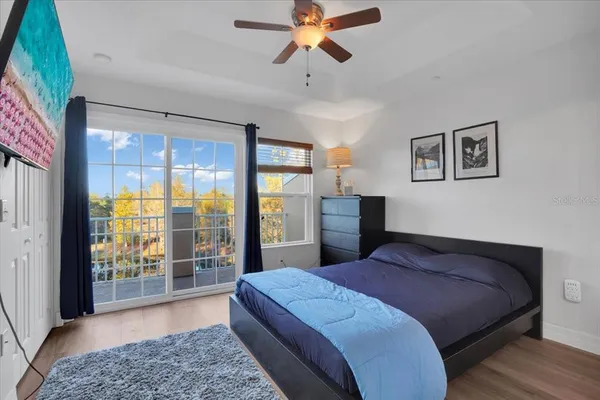 a bed sitting in a bedroom next to a window