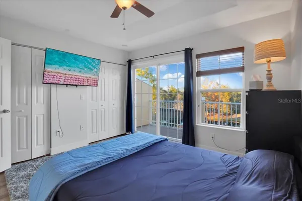 a bedroom with a large bed and a window