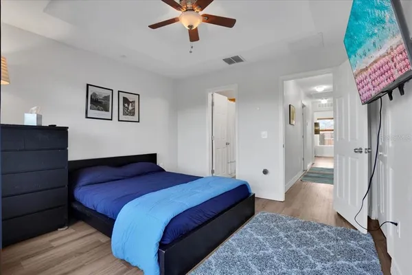 a bedroom with a bed and a view of bathroom