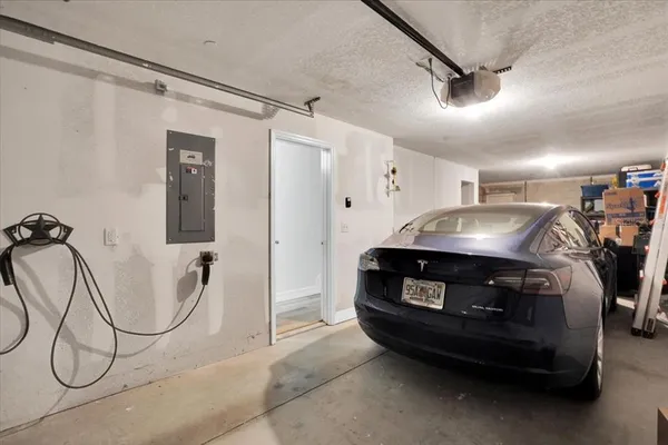 a living room with furniture a air conditioner and a window