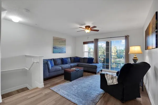 a living room with furniture and a large window