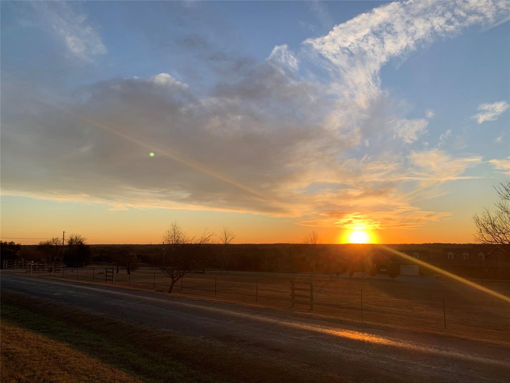 7 Stone Marshall Road Van Alstyne, TX 75495 - Photo 1 of 1 View of asphalt road featuring a rural view