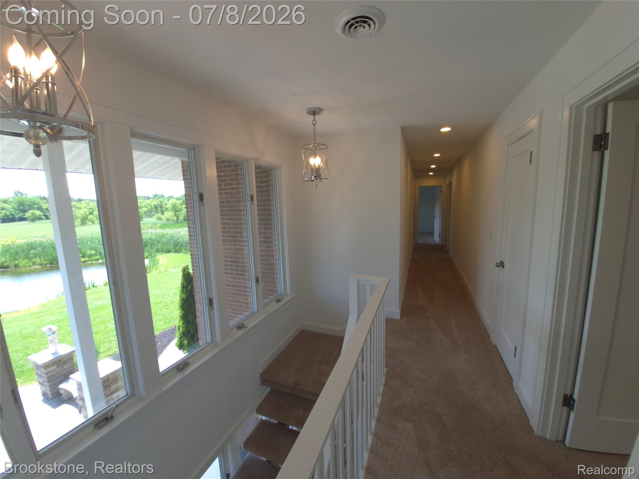 4140 South Henderson Road Davison, MI 48423 - Photo 37 of 98 Upper-level hallway with neutral carpet flooring and recessed lighting