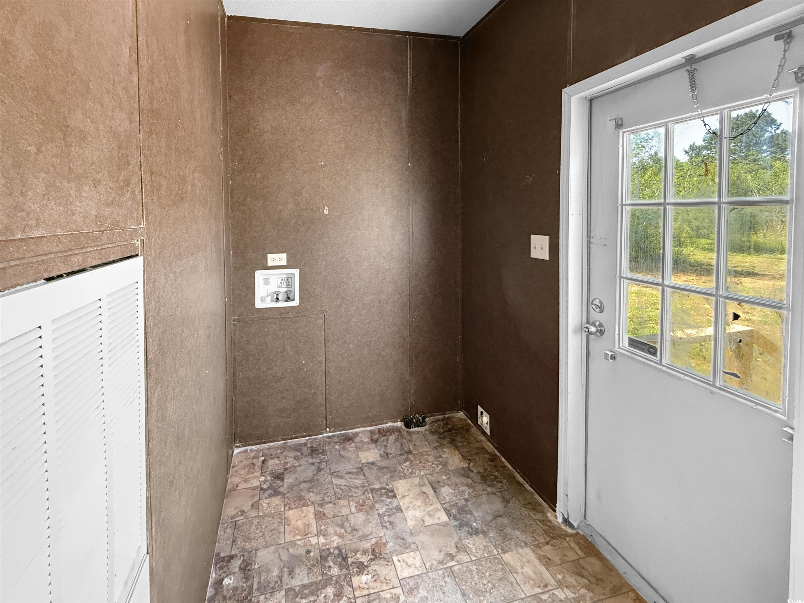 111 Morrisville Road Andrews, SC 29510 - Photo 23 of 28 Laundry area featuring a healthy amount of sunlight, washer hookup, and stone finish flooring