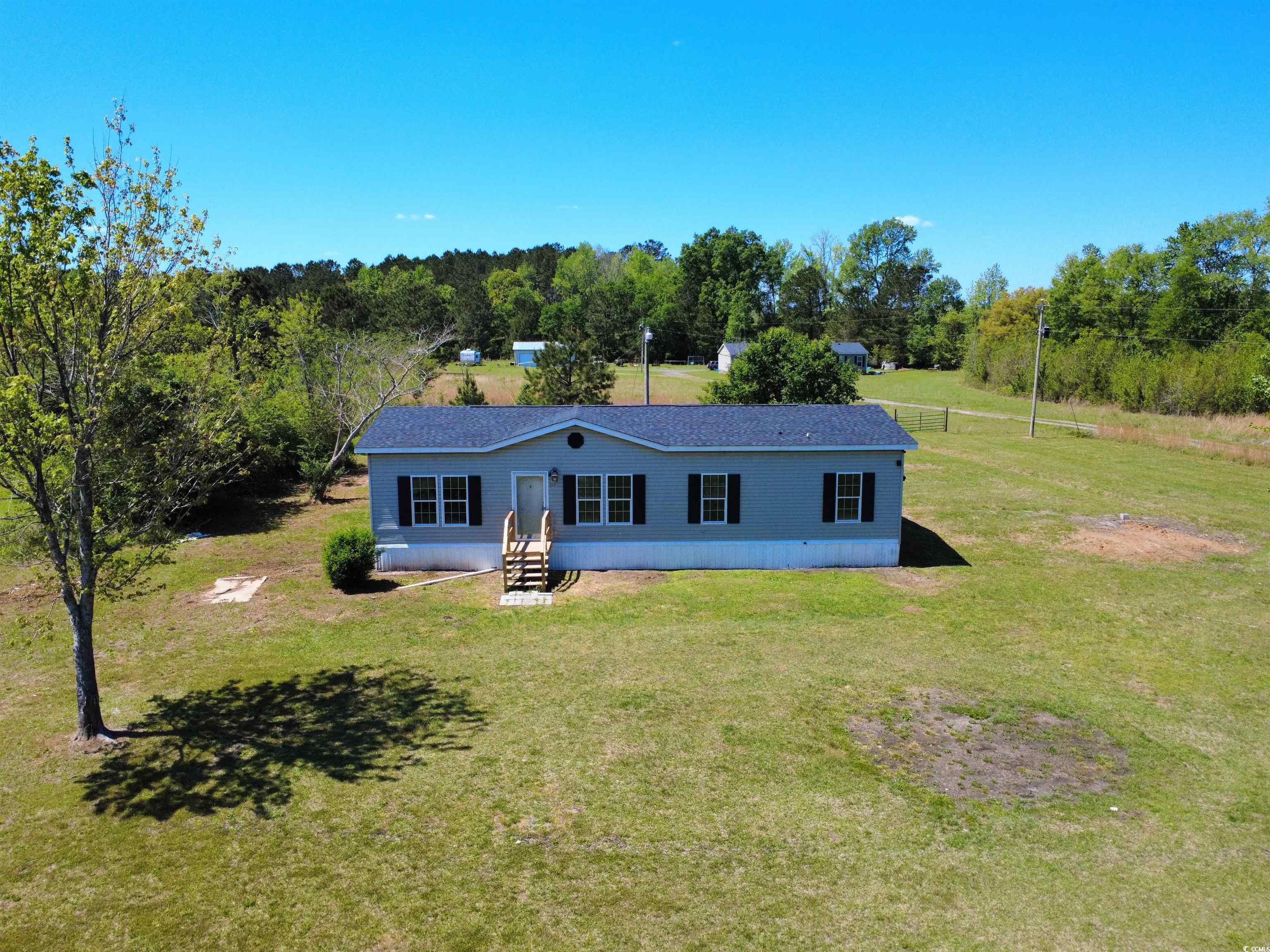 111 Morrisville Road Andrews, SC 29510 - Photo 4 of 28 View of front facade with a front lawn