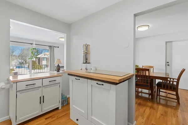 a kitchen that has a table and chairs in it