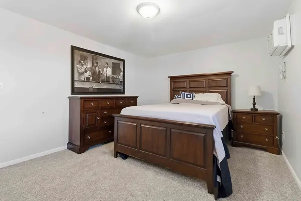a bedroom with a bed and a cabinets