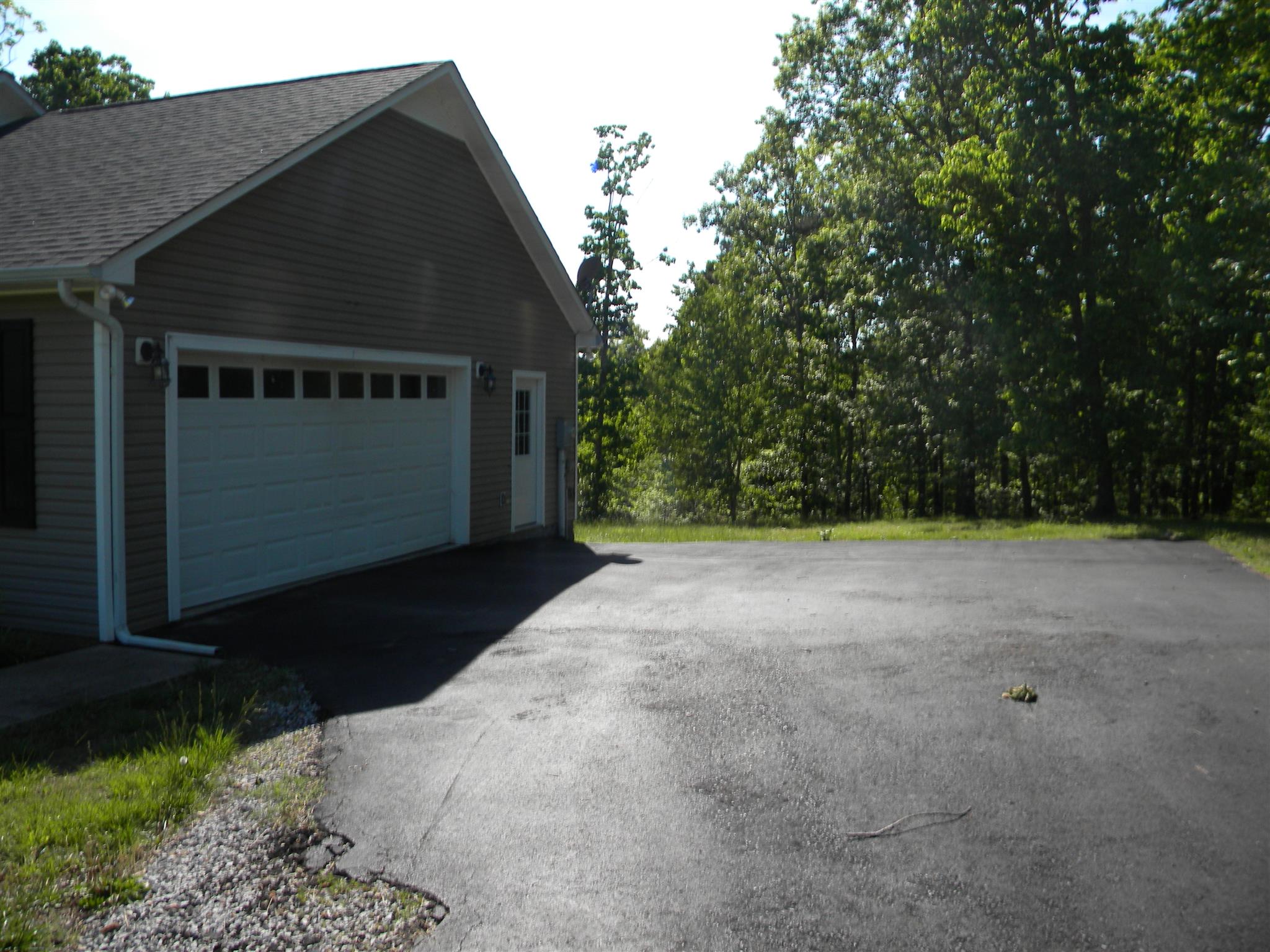 155 Northview Road Hohenwald, TN 38462 - Photo 5 of 28 Attached garage w/blacktop driveway