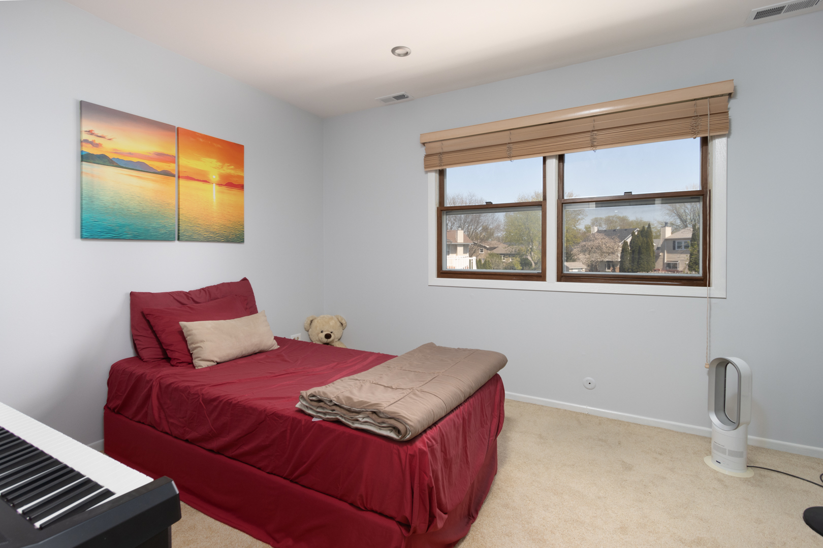 845 Deerpath Lane Hoffman Estates, IL 60169 - Photo 13 of 27 a bedroom with a bed and next to a window