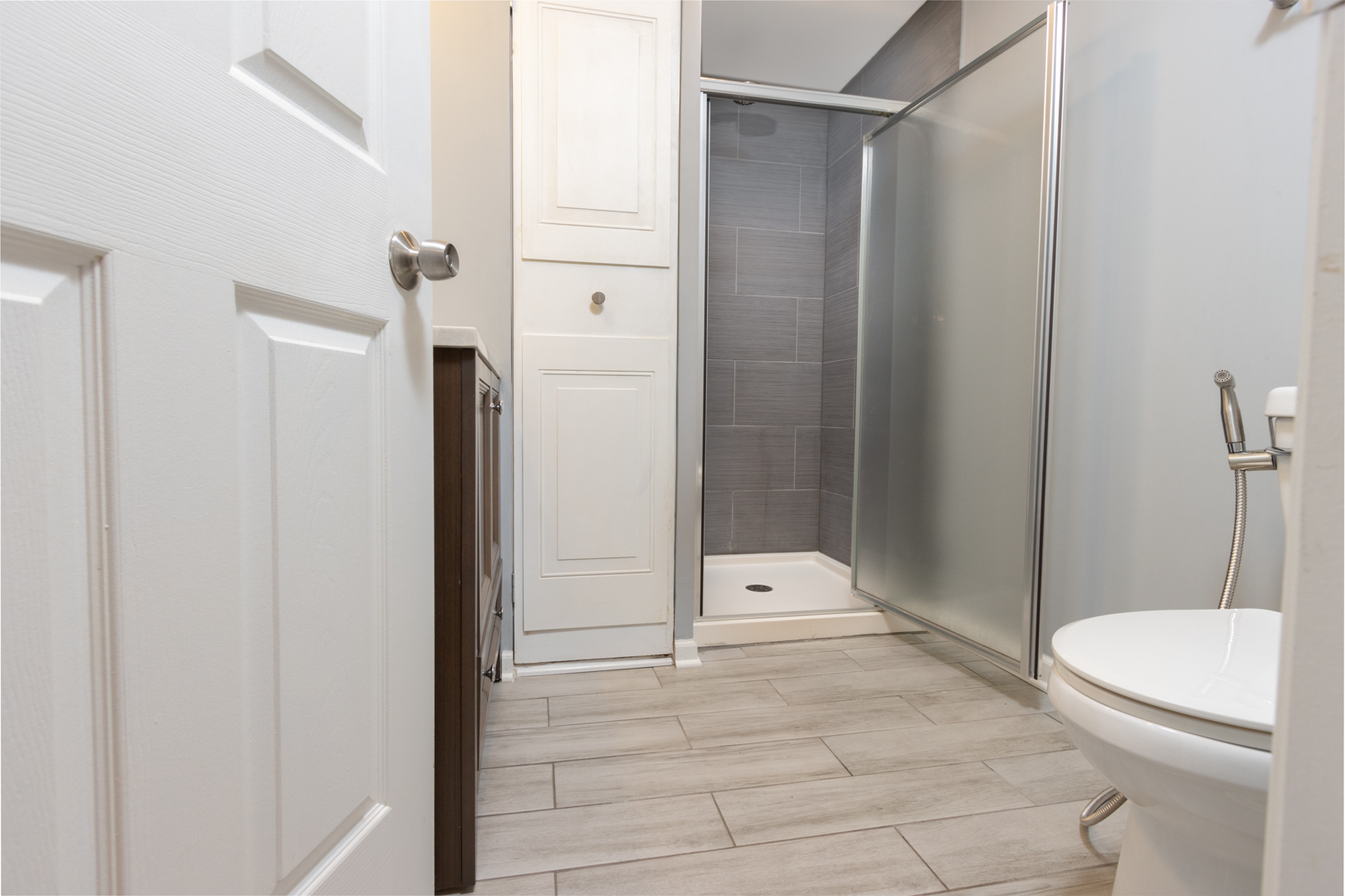 845 Deerpath Lane Hoffman Estates, IL 60169 - Photo 16 of 27 a bathroom with a shower and a toilet