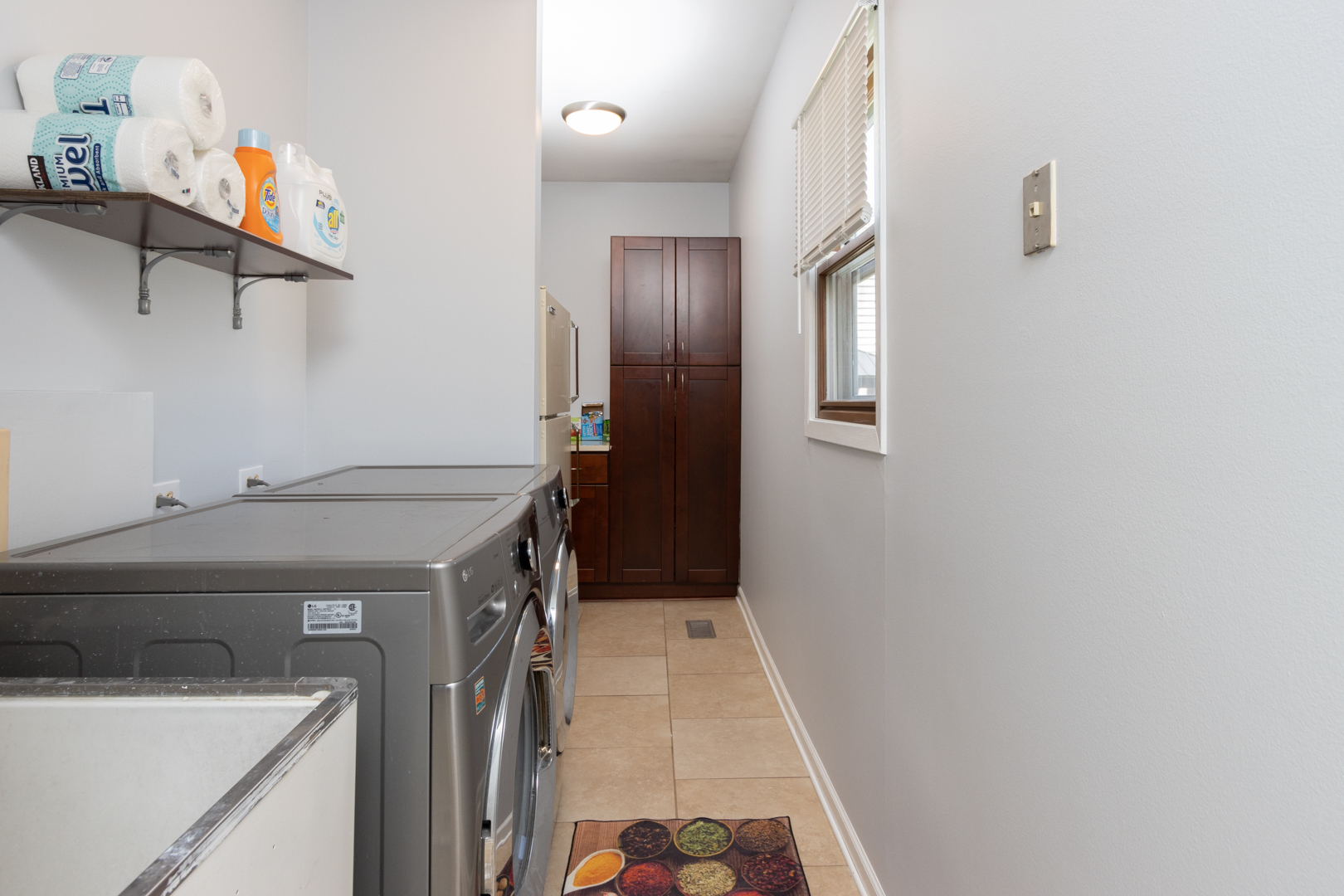 845 Deerpath Lane Hoffman Estates, IL 60169 - Photo 20 of 27 a utility room with a sink a washer and dryer