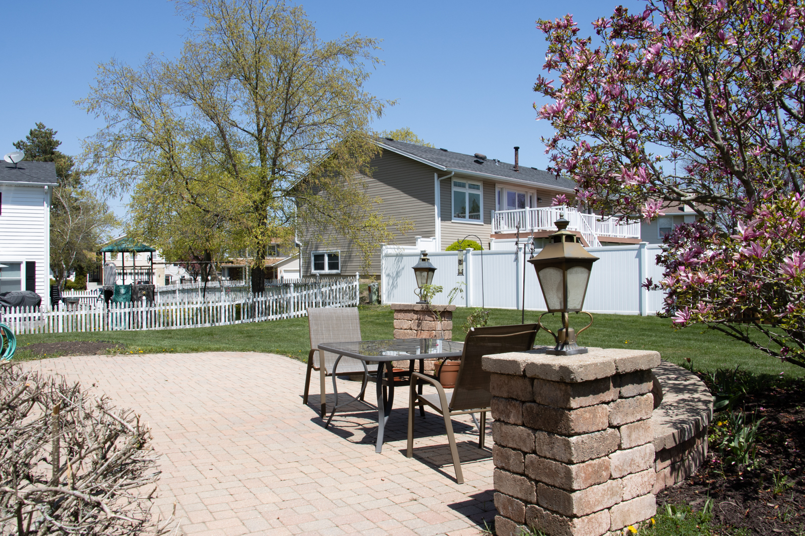845 Deerpath Lane Hoffman Estates, IL 60169 - Photo 21 of 27 a front view of a house with garden and sitting area