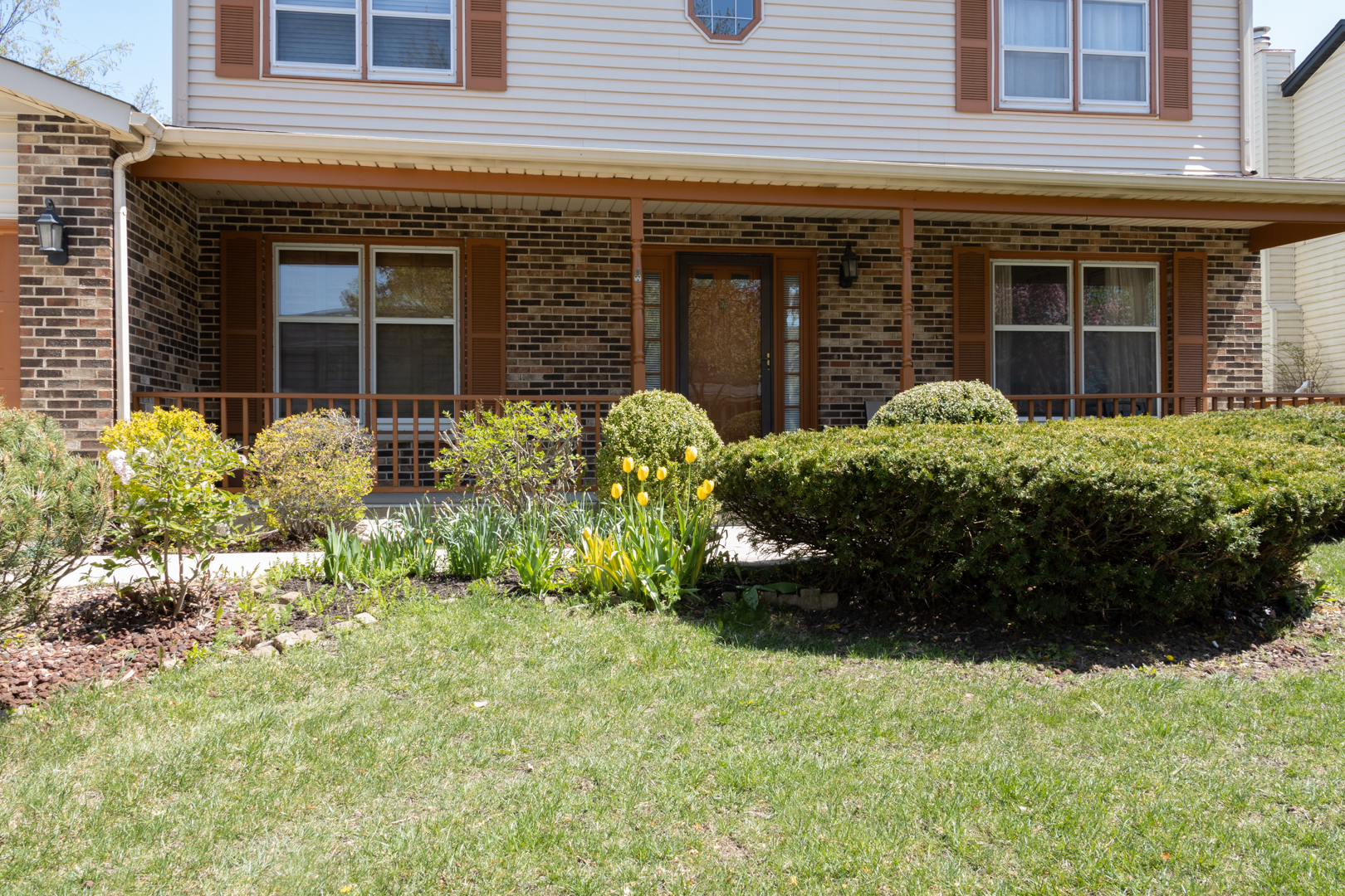 845 Deerpath Lane Hoffman Estates, IL 60169 - Photo 23 of 27 front view of a brick house with a yard