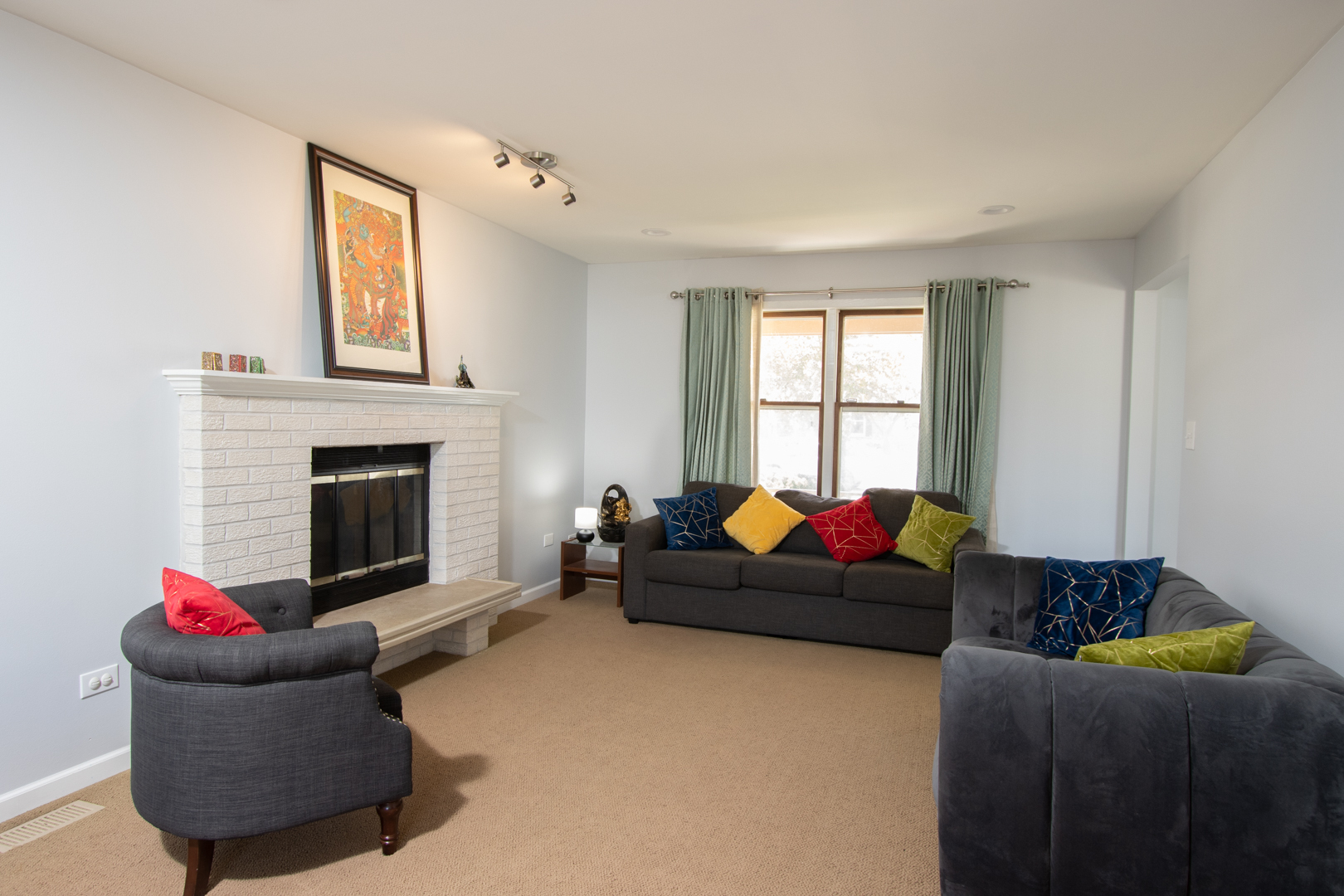 845 Deerpath Lane Hoffman Estates, IL 60169 - Photo 7 of 27 a living room with furniture and a fireplace