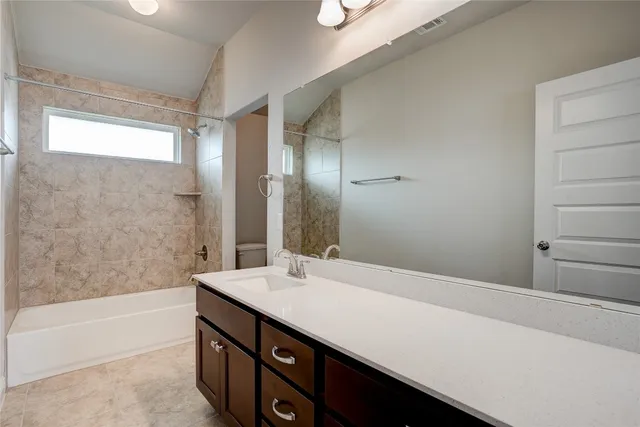 a bathroom with a sink a bathtub and a large mirror