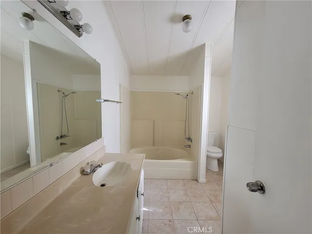a view of a bathroom with a glass door shower