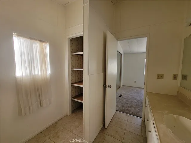 a view of an empty room and a window