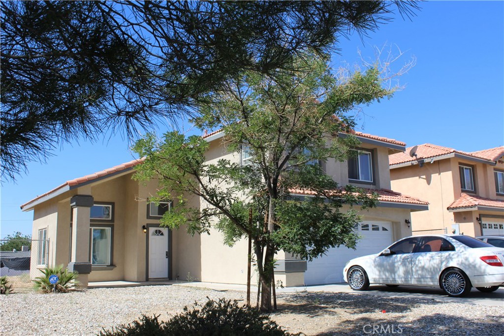 15705 Tern Road Victorville, CA 92394 - Photo 3 of 4 a car parked in front of a house