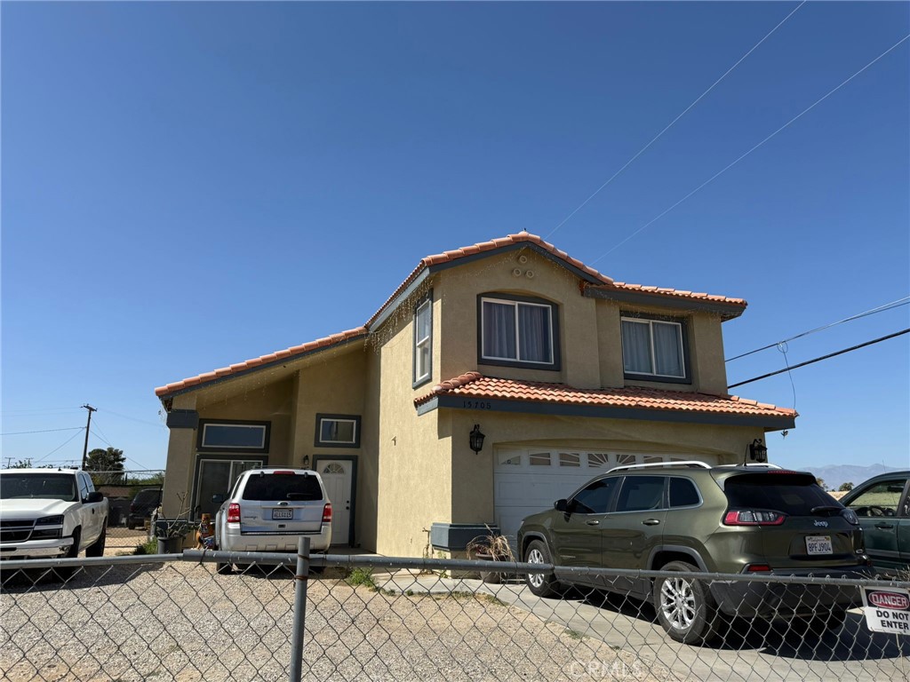 15705 Tern Road Victorville, CA 92394 - Photo 4 of 4 a car parked in front of a house