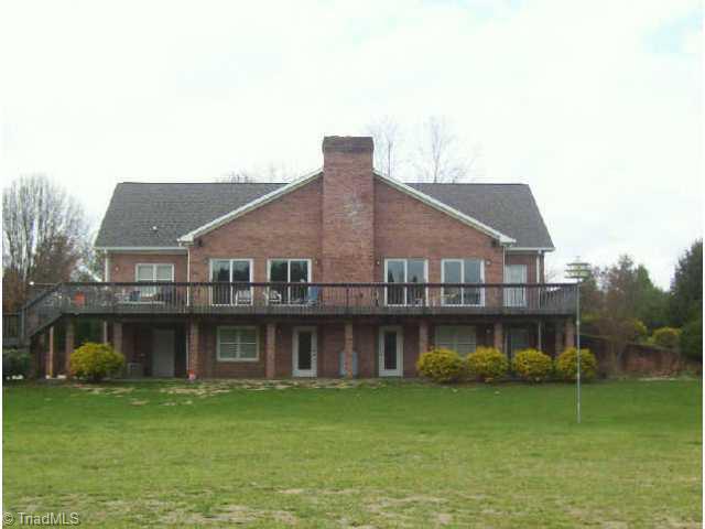260 Cornatzer Road Mocksville, NC 27028 - Photo 2 of 9 Other. Rear of home. Note large deck, patio underneath, walk-out basement, many windows.