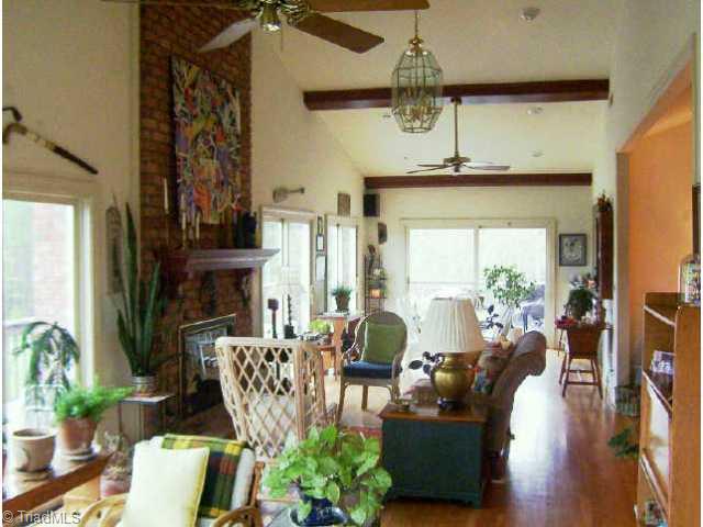 260 Cornatzer Road Mocksville, NC 27028 - Photo 5 of 9 Other. Note cathedral ceiling with exposed beams, hardwood floor and masonry gas log fireplace.