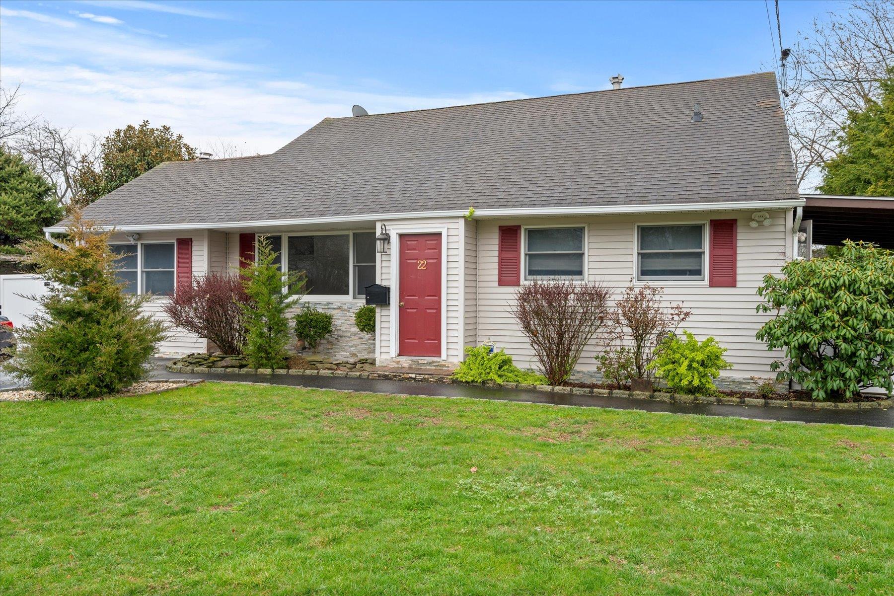 22 Farragut Avenue Bay Shore, NY 11706 - Photo 1 of 1 View of front of home featuring a front yard and a shingled roof