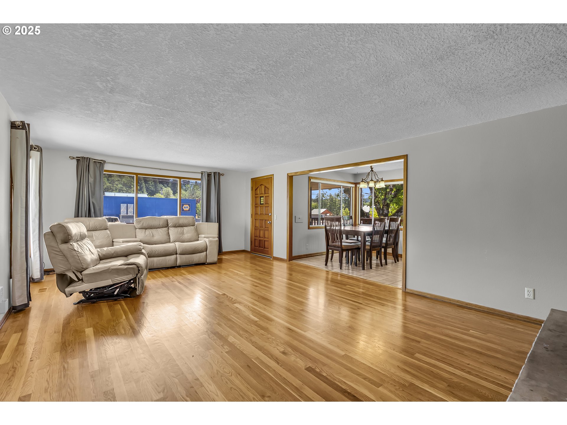 821 Bridge Street Vernonia, OR 97064 - Photo 16 of 45 a living room with furniture and a wooden floor