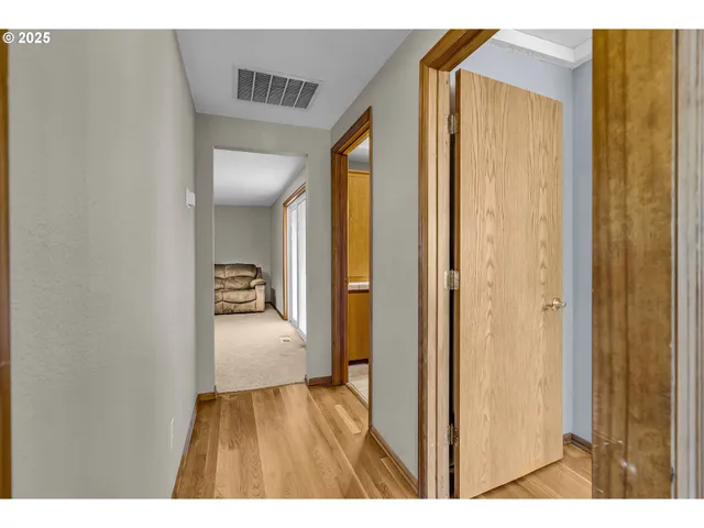 a view of hallway with bathroom