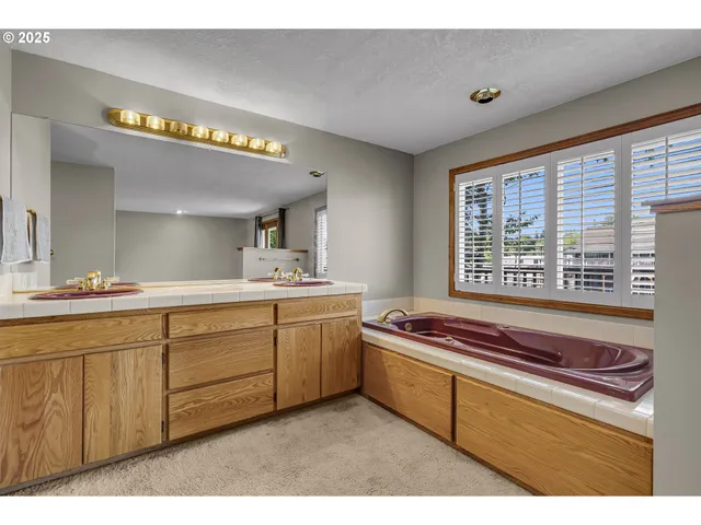 a kitchen with sink cabinets and window