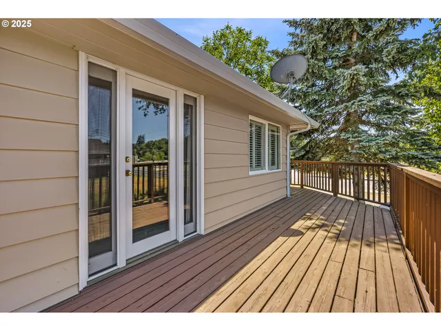 a view of wooden balcony with wooden floor and fence