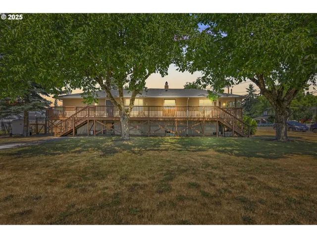 a backyard of a house with lots of green space